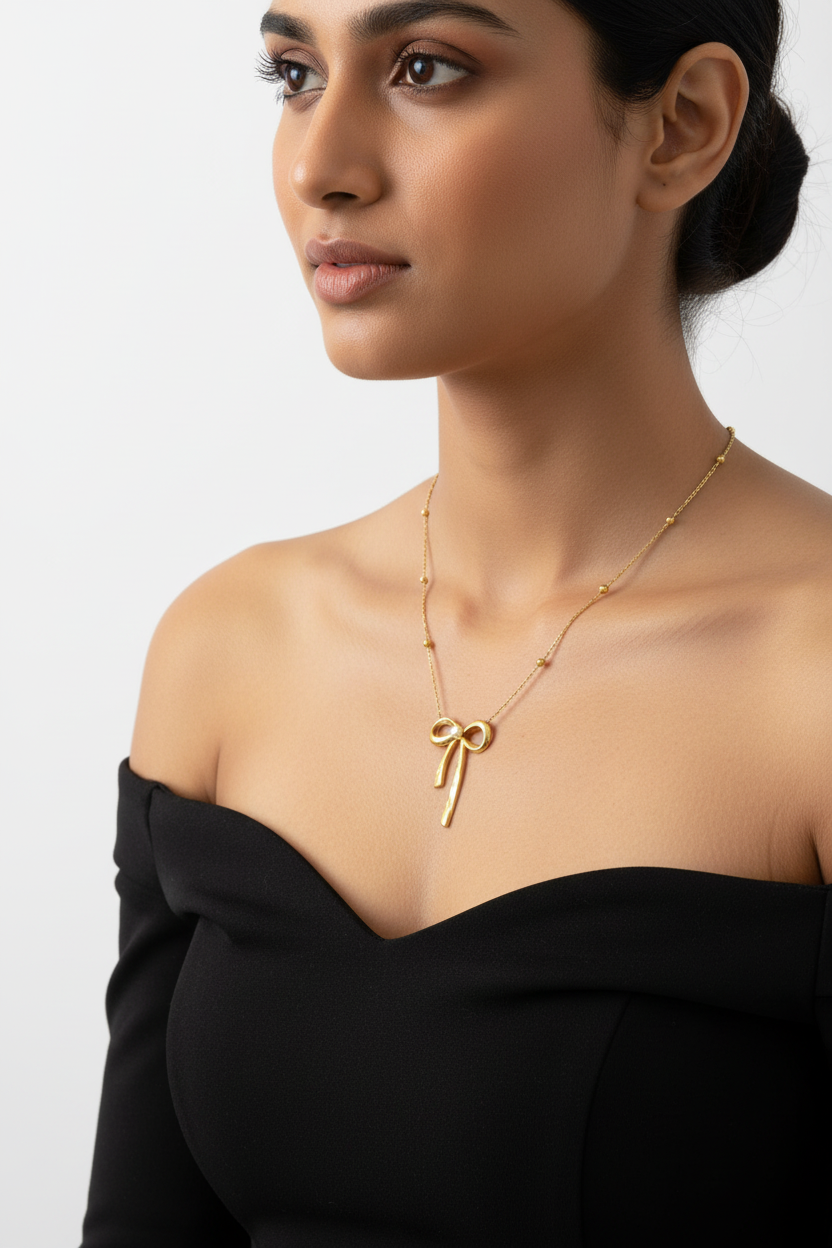 Gold Pearl-Center Bow Pendant